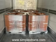 Transshipment of motor oil on pallets from a sea container to a truck in the port of Poti in Georgia.